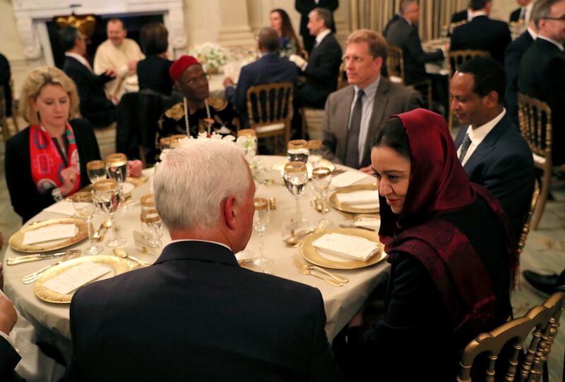 ‪Vice President Mike Pence‬ chats with a guest while participating in the White House Iftar dinner in the State Dining Room at the White House in Washington, U.S., May 13, 2019. REUTERS/Leah Millis