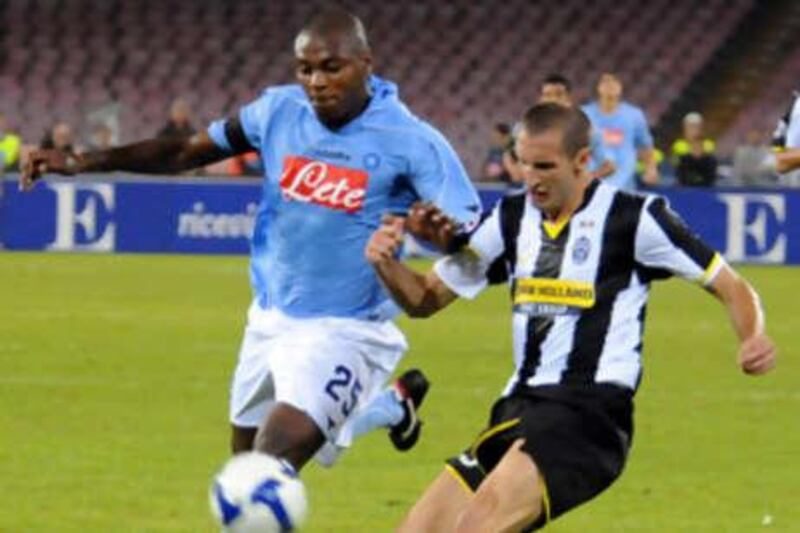 Juventus' Giorgio Chiellini, right, and Napoli's Marcelo Zalayeta tussle for the ball.