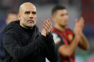 Manchester City's Spanish manager Pep Guardiola applauds the fans after the UEFA Champions League round of 16, first-leg football match between RB Leipzig and Manchester City in Leipzig, eastern Germany on February 22, 2023.  (Photo by Odd ANDERSEN  /  AFP)