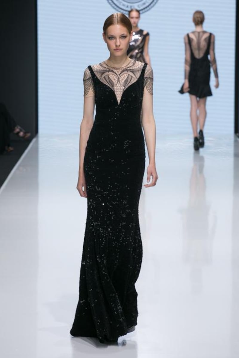 Cinco’s timeless black numbers boasted intricate embroidery, applique flowers and crystals. Courtesy Michael Cinco and Couturissimo