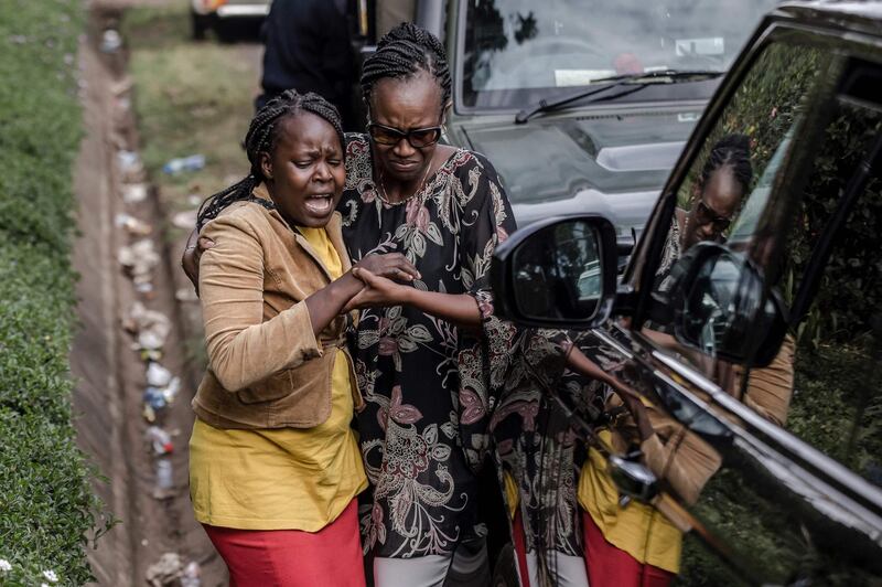 A woman is rescued at the scene of an on going terrorist attack at a hotel complex in Nairobi's Westlands suburb. Fifteen people have died in the Islamist attack on an upmarket hotel complex in Nairobi, Kenyan police sources said on January 16, as fresh explosions and gunfire rang out in the siege which stretched into its second day. AFP