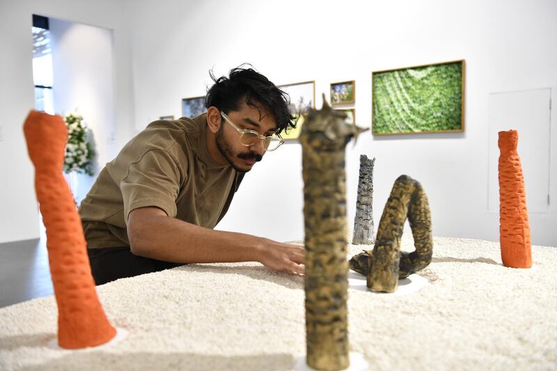 Artist Mohamed Khalid with his 'Flaccid' sculptures. Courtesy Warehouse421