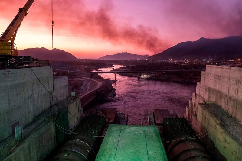 A general view of the Blue Nile river as it passes through the Grand Ethiopian Renaissance Dam (GERD), near Guba in Ethiopia, on December 26, 2019. The Grand Ethiopian Renaissance Dam, a 145-metre-high, 1.8-kilometre-long concrete colossus is set to become the largest hydropower plant in Africa.
Across Ethiopia, poor farmers and rich businessmen alike eagerly await the more than 6,000 megawatts of electricity officials say it will ultimately provide. 
Yet as thousands of workers toil day and night to finish the project, Ethiopian negotiators remain locked in talks over how the dam will affect downstream neighbours, principally Egypt. / AFP / EDUARDO SOTERAS
