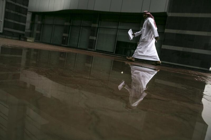 Abu Dhabi residents woke up to a gloomy and rainy weather on Wednesday morning, March 26 2014. Silvia Razgova / The National