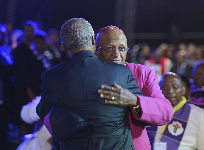 South Africa's archbishop emeritus Desmond Tutu, right, and the former South African President Thabo Mbeki greet each other before the funeral ceremony. Odd Andersen / EPA
