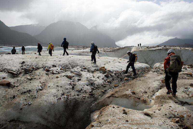 A party from the National Forestry Corporation at the Exploradores glacier in Laguna San Rafael National Park in southern Chile, where climate change is causing glaciers to melt.   EPA