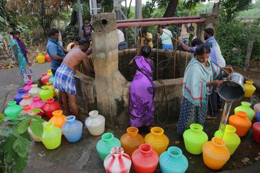 In the village of Pallam just outside Chennai, some 70 families draw lots to determine when they can draw from a communal well. AP