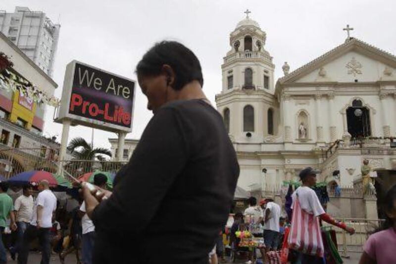 A ‘Pro-Life’ sign flashes on an electric signboard outside the Roman Catholic Minor Basilica of the Black Nazarene in downtown Manila.