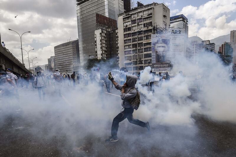 Venezuelan police throw tear gas at opposition activists during protests against the government of president Nicolas Maduro in Caracas. The centre-right opposition blame the country’s economic crisis on the president. Juan Barreto / AFP / April 6, 2017