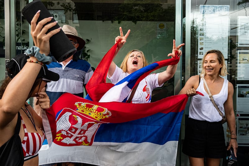 Supporters gather outside Park Hotel in Melbourne where Novak Djokovic was taken pending his removal from the country after his visa was cancelled by the Australian Border Force on January 06, 2022 in Melbourne, Australia. Getty Images