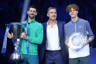 Winner Novak Djokovic, left, of Serbia and Jannik Sinner of Italy pose for a photo with ATP chief Andrea Gaudenzi following the final of the ATP Finals at Pala Alpitour on November 19, 2023 in Turin, Italy. Getty
