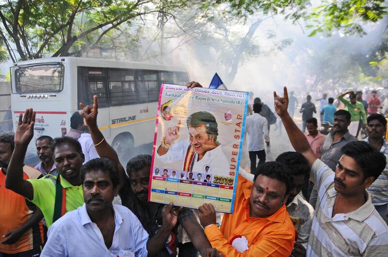 Indian movie superstar Rajinikanth fans burn firecrackers and hold his photograph after his announcement to launch his own political party. Rajinikanth is entering politics in his southern Indian state with a plan to launch his own party, calling it his duty. R.Parthibhan / AP photo