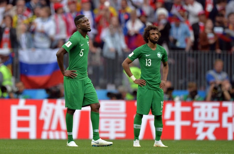 epa06807932 Omar Othman (L) of Saudi Arabia reacts during the FIFA World Cup 2018 group A preliminary round soccer match between Russia and Saudi Arabia in Moscow, Russia, 14 June 2018.

(RESTRICTIONS APPLY: Editorial Use Only, not used in association with any commercial entity - Images must not be used in any form of alert service or push service of any kind including via mobile alert services, downloads to mobile devices or MMS messaging - Images must appear as still images and must not emulate match action video footage - No alteration is made to, and no text or image is superimposed over, any published image which: (a) intentionally obscures or removes a sponsor identification image; or (b) adds or overlays the commercial identification of any third party which is not officially associated with the FIFA World Cup)  EPA/PETER POWELL   EDITORIAL USE ONLY