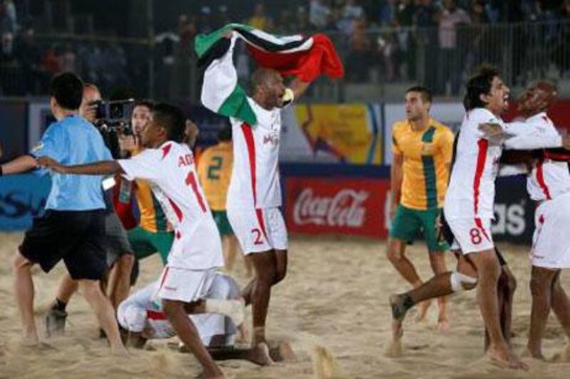 UAE players celebrate as Australia players look for the referee to argue that their goal beat the final whistle. The result would stand in the UAE's favour.