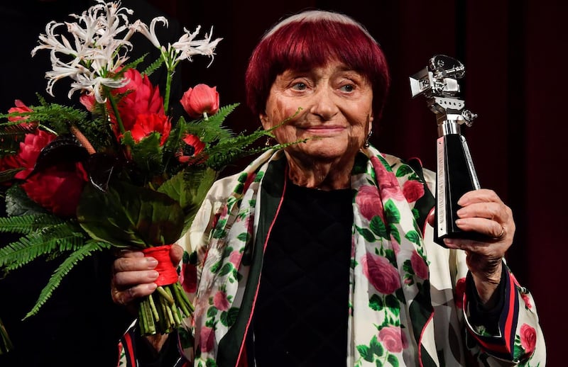 (FILES) In this file photo taken on February 13, 2019 French director Agnes Varda reacts on stage as she is awarded with the Berlinale Camera award at the 69th Berlinale film festival in Berlin. French New Wave film director Agnes Varda has died aged 90, according to her family on March 29, 2019. / AFP / John MACDOUGALL
