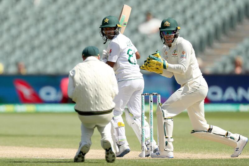 Australia's David Warner, left, catches Pakistan's Asad Shafiq in Adelaide on Monday. AP
