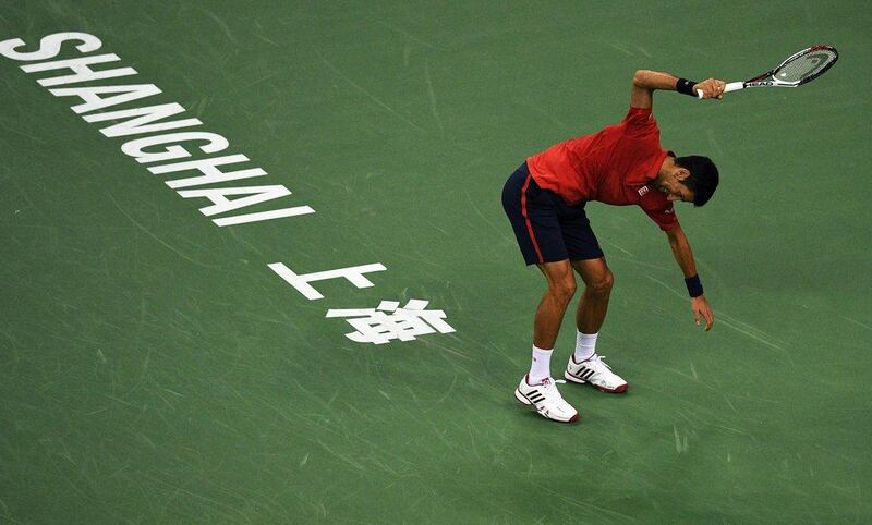 Novak Djokovic of Serbia smashing his racket after losing a point against Roberto Bautista Agut of Spain in their men's singles semi-finals match at the Shanghai Masters tennis tournament in Shanghai. Johannes Eisele / AFP