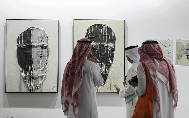 DUBAI , UNITED ARAB EMIRATES , MARCH 20  – 2017 :- Visitors looking the art work which is on display during the Art Dubai held at Madinat Jumeirah in Dubai. ( Pawan Singh / The National ) For Arts & Life. Story by Melissa 