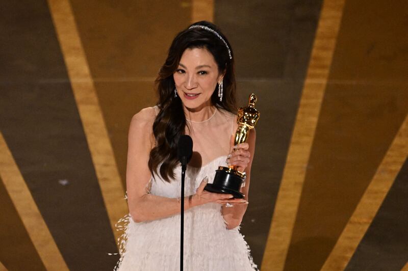 Malaysian actress Michelle Yeoh accepts the Oscar for Best Actress in a Leading Role for Everything Everywhere All at Once. AFP