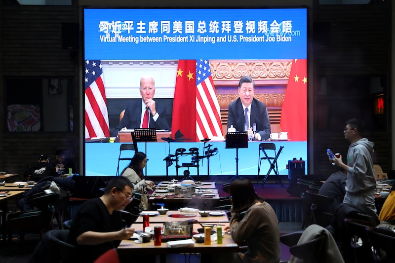Chinese President Xi Jinping attends a virtual meeting with US President Joe Biden via video link, at a restaurant in Beijing, China, on November 16. Reuters