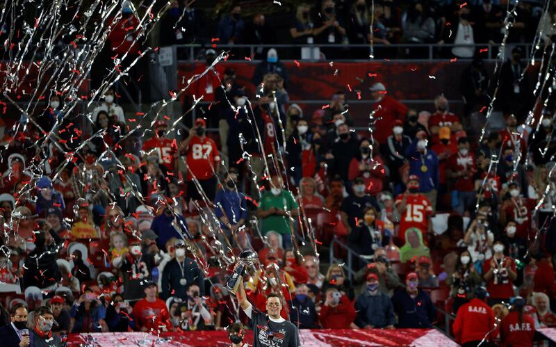 Tampa Bay Buccaneers' Tom Brady celebrates with the Vince Lombardi trophy after winning the Super Bowl LV. Reuters