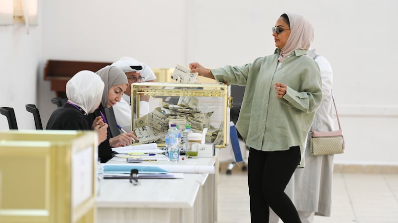 Kuwaitis cast their votes at a polling station during parliamentary elections in Kuwait last year. EPA