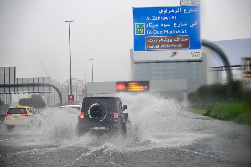 A motorist braves a waterlogged lane. Ahmed Ramzan for The National