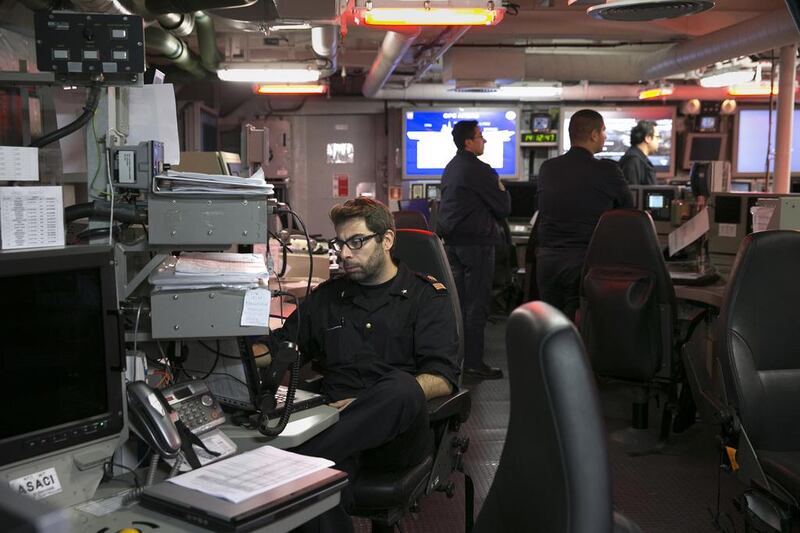 Ship personnel on the command control centre of the Italian aircraft carrier Cavour. Silvia Razgova / The National
