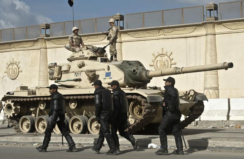 Egyptian army tanks are positioned outside Turah prison during the trial at the police institute in Cairo. Khaled Desouki / AFP



