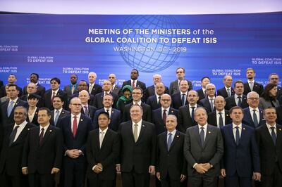 Mike Pompeo, U.S. secretary of state, center, stands with foreign ministers for a family photo during the Global Coalition to Defeat ISIS meeting at the State Department in Washington, D.C., U.S., on Wednesday, Feb. 6, 2019. Pompeo sought to reassure allies that President Donald Trump's troop withdrawal from Syria doesn't mean they are being left behind in the fight against Islamic State. Photographer: Al Drago/Bloomberg