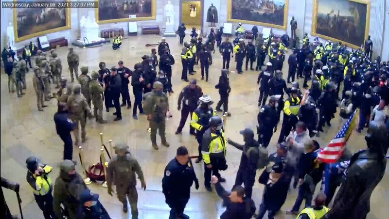 Police and rioters confront each other in the Rotunda of the Capitol. US Capitol Police via AP