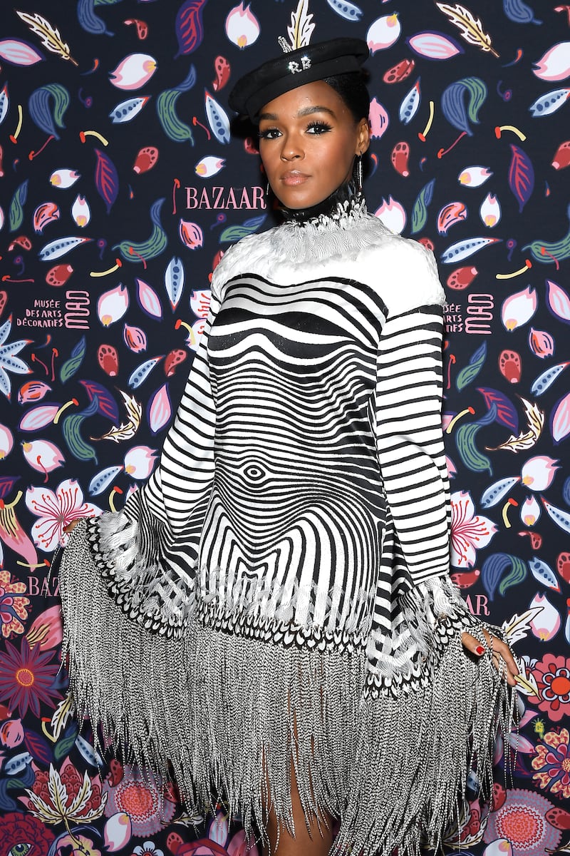 Janelle Monae, wearing a black and white optical illusion Jean Paul Gaultier dress, attends the Harper's Bazaar Exhibition at Paris Fashion Week on February 26, 2020. Getty Images