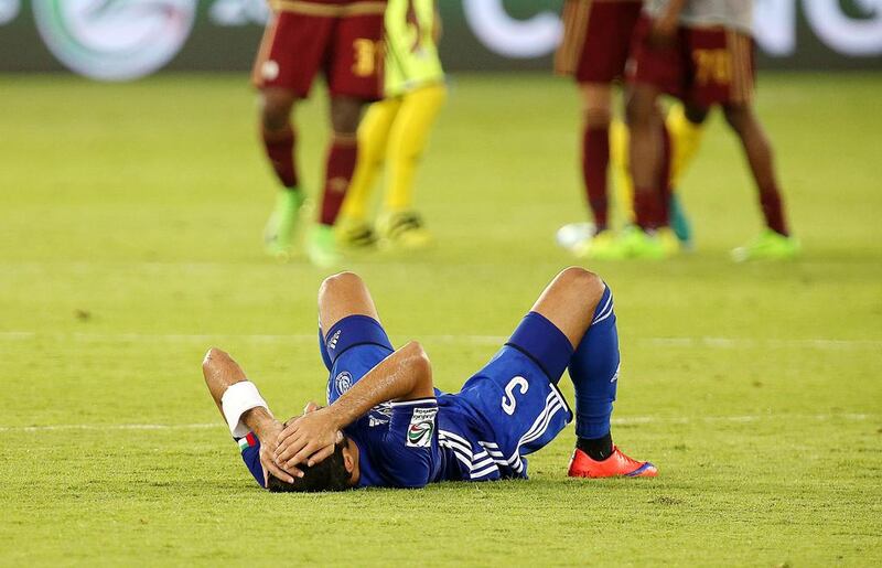 An Al Nasr player slumps to the ground following his side’s defeat in the President’s Cup final.