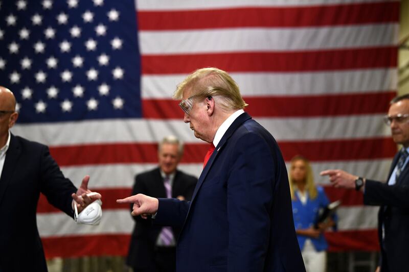 TOPSHOT - US President Donald Trump participates in a tour of a Honeywell International plant that manufactures personal protective equipment in Phoenix, Arizona on May 5, 2020.  / AFP / Brendan Smialowski
