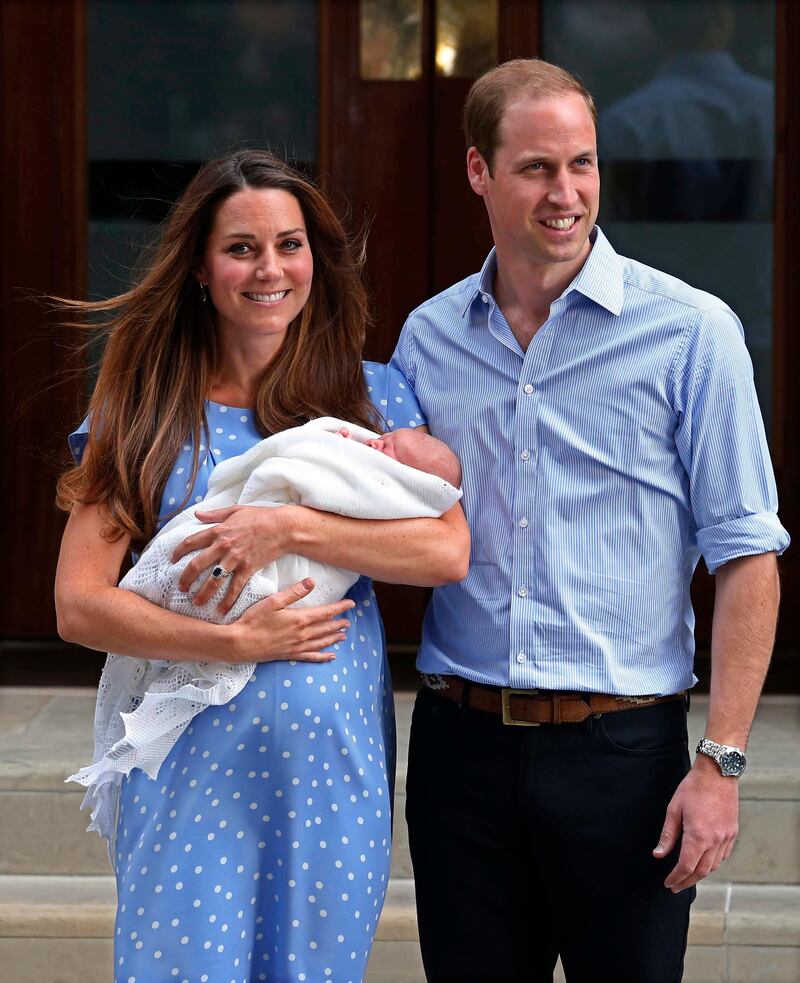Britain's Prince William and his wife Catherine, Duchess of Cambridge appear with their baby son, outside the Lindo Wing of St Mary's Hospital, in central London July 23, 2013. Kate gave birth to the couple's first child, who is third in line to the British throne, on Monday afternoon, ending weeks of feverish anticipation about the arrival of the royal baby. REUTERS/Suzanne Plunkett (BRITAIN - Tags: SOCIETY ROYALS HEALTH) *** Local Caption ***  SLP112_BRITAIN-ROYA_0723_11.JPG