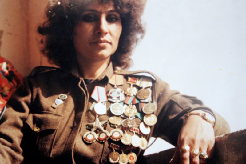 Mohammadzai wears her army uniform adorned with medals in the 1980s.