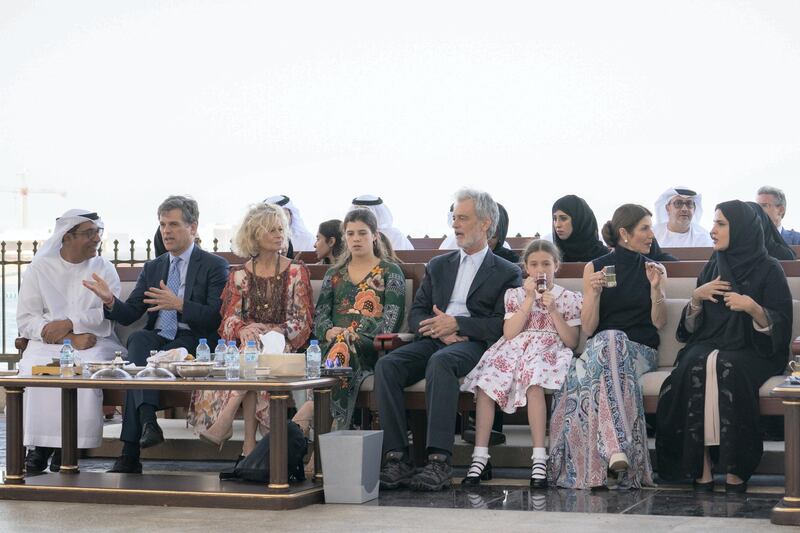 ABU DHABI, UNITED ARAB EMIRATES - March 18, 2019: HE Mohamed Al Junaibi, Director of the President's Protocol Office at the UAE Ministry of Presidential Affairs (L), Timothy Shriver, Chairman of the Special Olympics (2nd L) and Shriver family members, attend a Sea Palace barza.

( Ryan Carter / Ministry of Presidential Affairs )?
---