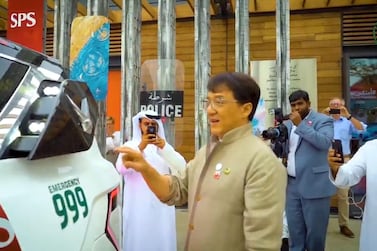 Actor Jackie Chan takes a closer look at the Dubai Police's supercar while visiting their Smart Police Station at La Mer. 