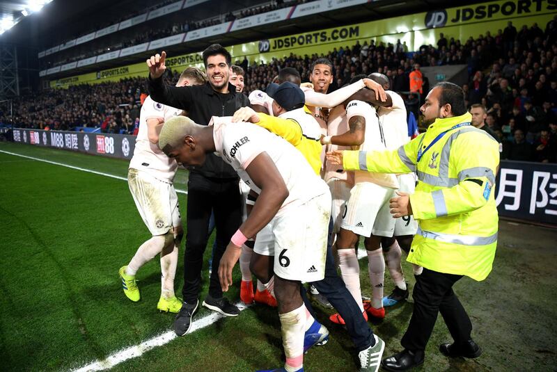 United's players celebrate their third goal, which sealed victory. Getty