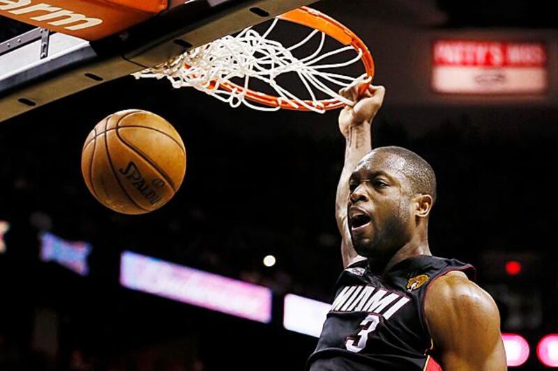 Miami Heat's Dwyane Wade dunks against the San Antonio Spurs during the fourth quarter in Game 4 of their NBA Finals basketball series in San Antonio, Texas June 13, 2013. REUTERS/Lucy Nicholson (UNITED STATES  - Tags: SPORT BASKETBALL)  