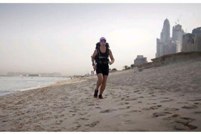 Doris Matlok trains on the beach in JBR for a 250-kilometre desert run. Lee Hoagland / The National