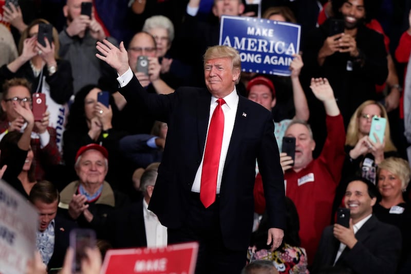 President Donald Trump takes the stage to speak at a campaign rally in Indianapolis, Friday, Nov. 2, 2018. (AP Photo/Michael Conroy)