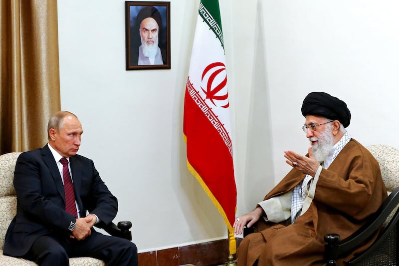 In this picture released by the office of the Iranian supreme leader, Supreme Leader Ayatollah Ali Khamenei, right, speaks with Russian President Vladimir Putin during their meeting in Tehran, Iran, Wednesday, Nov. 1, 2017. Putin arrived Wednesday for trilateral talks with Tehran and Azerbaijan, a meeting that comes as the Islamic Republic's nuclear deal is threatened by U.S. President Donald Trump's refusal to re-certify the accord. (Office of the Iranian Supreme Leader via AP)
