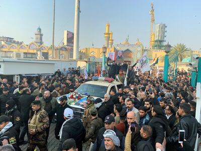 People gather at the funeral of the Iranian Major-General Qassem Soleimani, top commander of the elite Quds Force of the Revolutionary Guards, and the Iraqi militia commander Abu Mahdi al-Muhandis, who were killed in an air strike at Baghdad airport, in Baghdad, Iraq, January 4, 2020. REUTERS/Wissm al-Okili