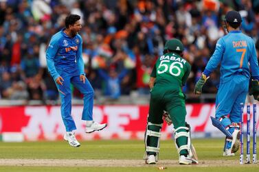 India bowler Kuldeep Yadav celebrates the wicket of Pakistan's Babar Azam during the Cricket World Cup match at Old Trafford. Reuters