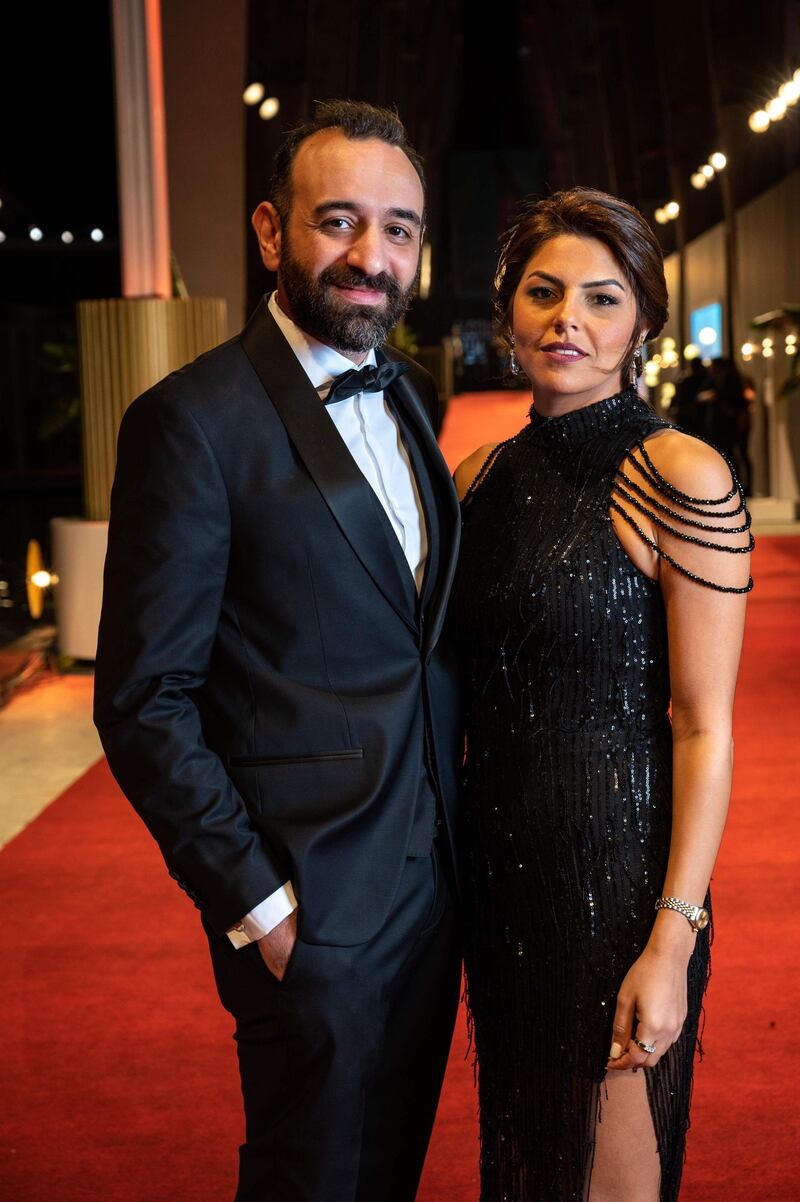 Egyptian director Amr Salama and his partner arrive for closing ceremony of 4th edition of the Gouna Film Festival, in Egypt's Red Sea resort of el-Gouna on October 30, 2020.  - XGTY / RESTRICTED TO EDITORIAL USE - MANDATORY CREDIT "AFP PHOTO / EL GOUNA FILM FESTIVAL  - NO MARKETING NO ADVERTISING CAMPAIGNS - DISTRIBUTED AS A SERVICE TO CLIENTS -
 / AFP / El Gouna Film Festival / Ammar Abd Rabbo / XGTY / RESTRICTED TO EDITORIAL USE - MANDATORY CREDIT "AFP PHOTO / EL GOUNA FILM FESTIVAL  - NO MARKETING NO ADVERTISING CAMPAIGNS - DISTRIBUTED AS A SERVICE TO CLIENTS -
