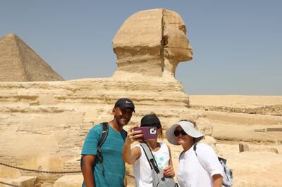 Tourists visit the pyramids and the Sphinx in Giza, Egypt. EPA