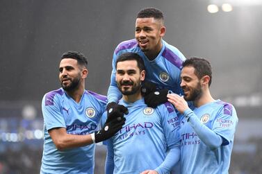 Manchester City midfielder Ilkay Gundogan, centre, sent a video message of support to staff in a clinic in Nuremberg. Getty