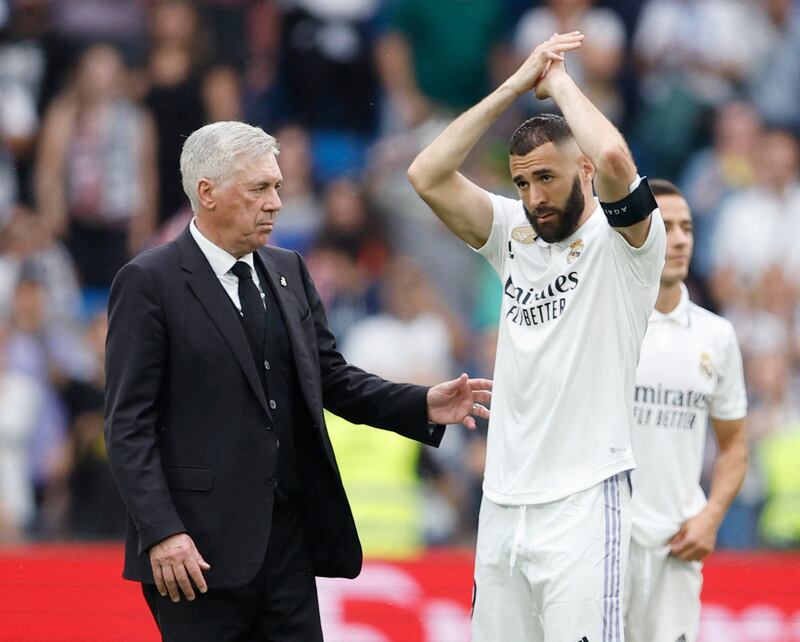 Real Madrid's Karim Benzema applauds fans after the match with coach Carlo Ancelotti. Reuters