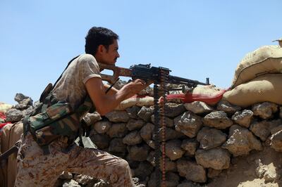 epa09178119 A fighter loyal to Yemen's Saudi-backed government takes position during the fight against Houthi militiamen in the northeastern province of Marib, Yemen, 11 April 2021 (issued 05 May 2021). The offensive by Yemen's Houthi rebels to take Marib city, the last government-held province in the country's north, is facing an increasingly heavy resistance. Government forces and allied tribal fighters stationed in and around the capital city of the oil-rich province of Marib have so far managed to stop the rebels' advance further into the city of around three million inhabitants, and located around 190 kilometer east of Sanaa.  EPA/STRINGER